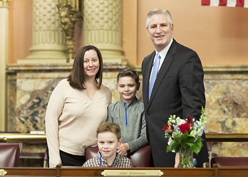 Rep. Todd Stephens, with his wife, Nicole, and two sons, Will and Ben, prepares to take the oath of office for the 2021-22 House session.